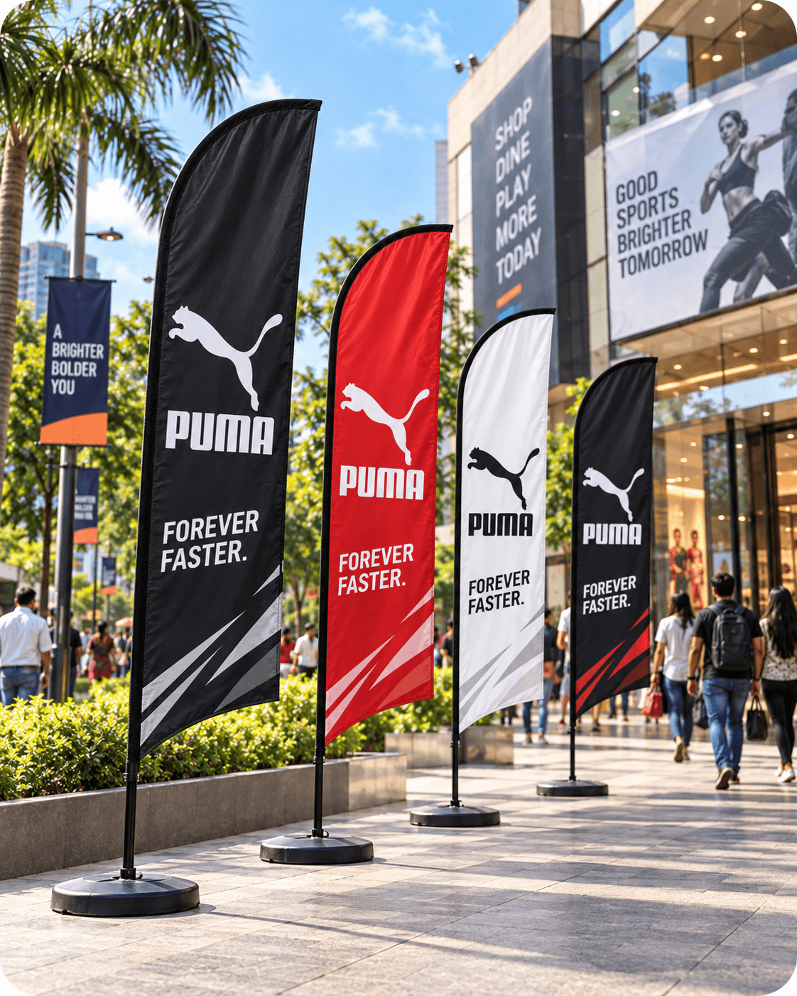 A row of branded feather flags outside a mall entrance